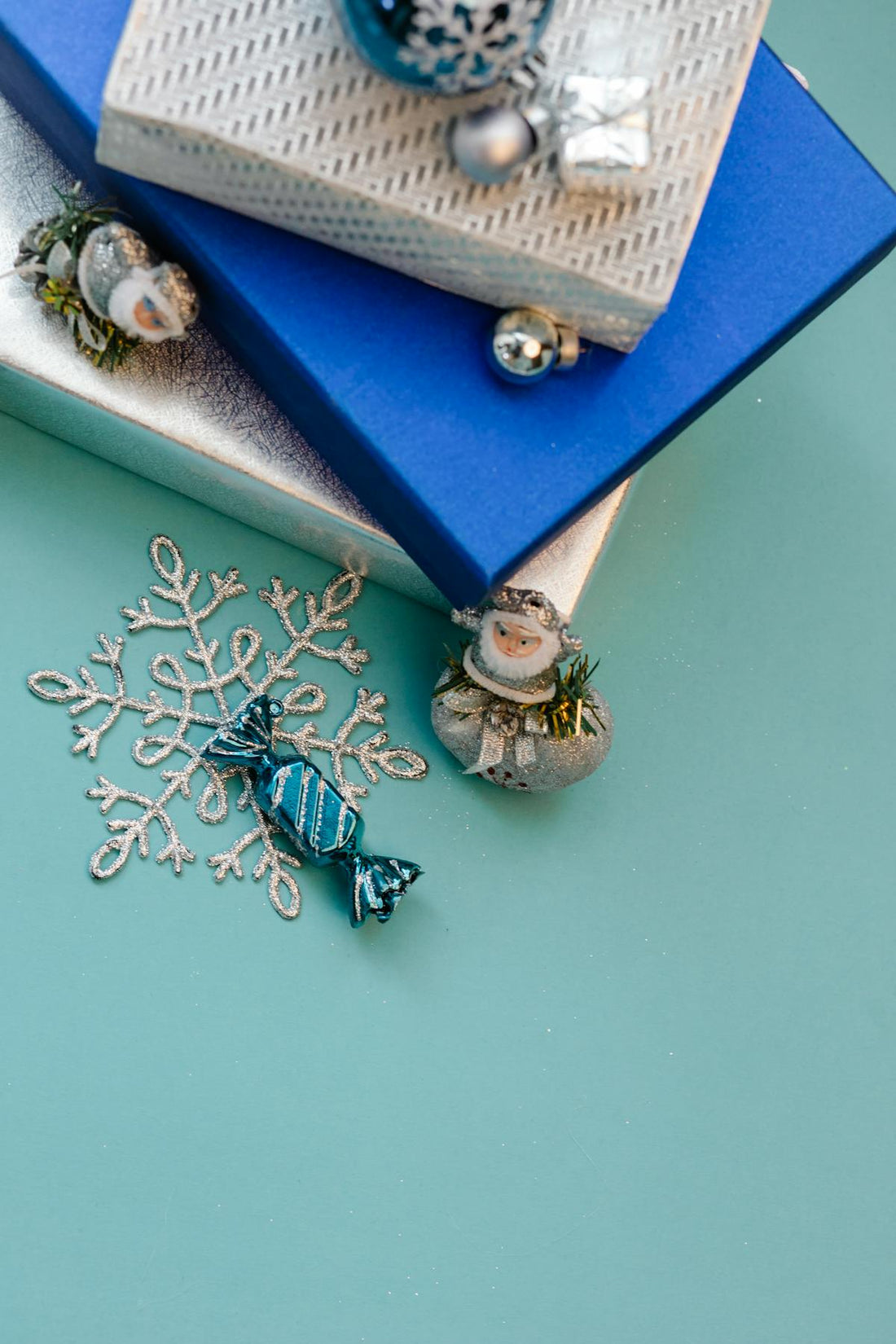 Wrapped gift boxes on a blue and mint background for a cute slime gift checklist