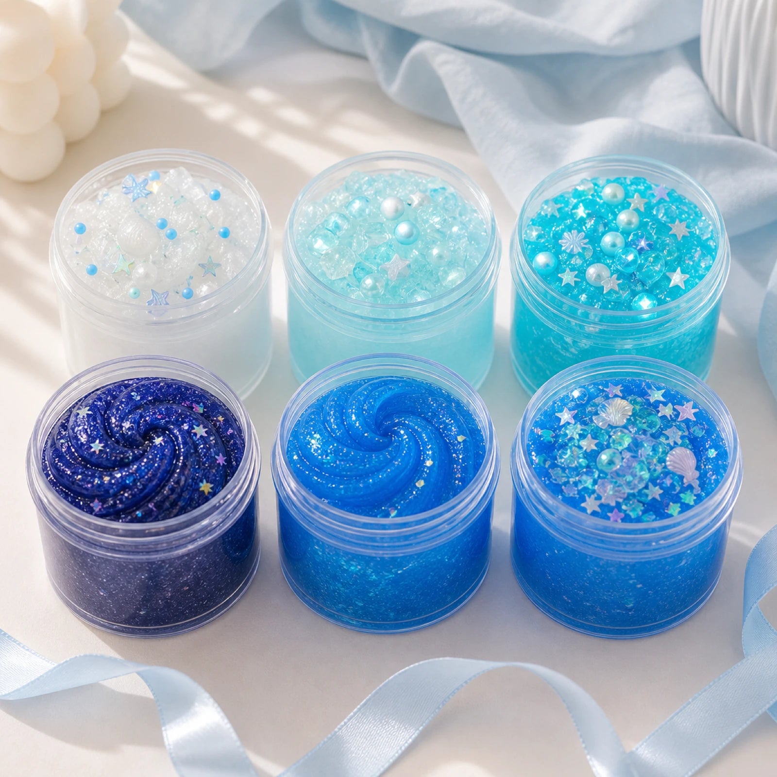 Blue slime tubs styled on a cozy pastel desk