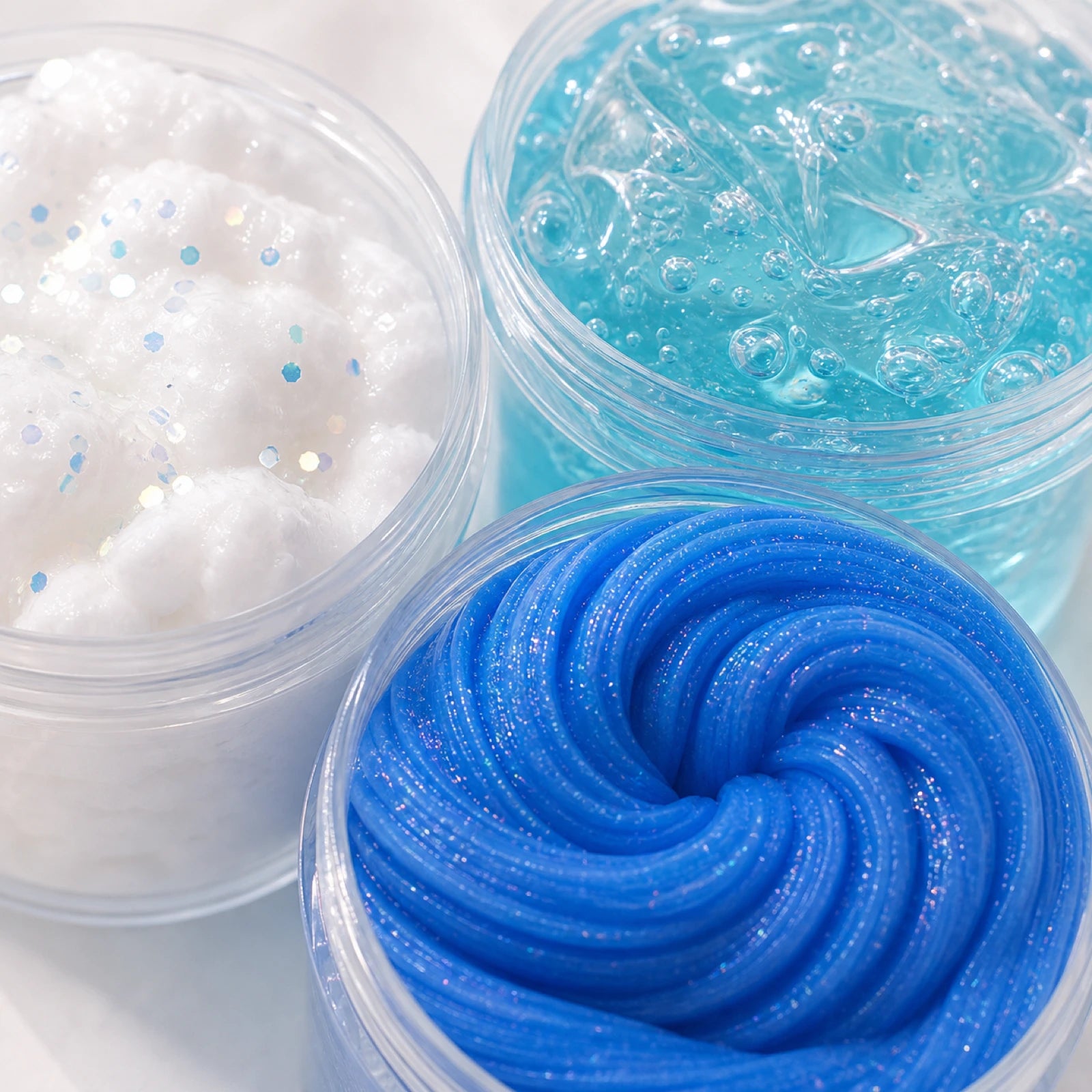 Close-up of blue ocean slime textures in open tubs