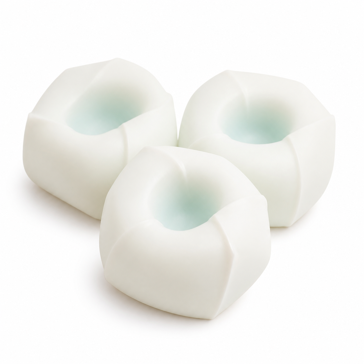 Tofu mochi squishy stress balls on a clean warm white background