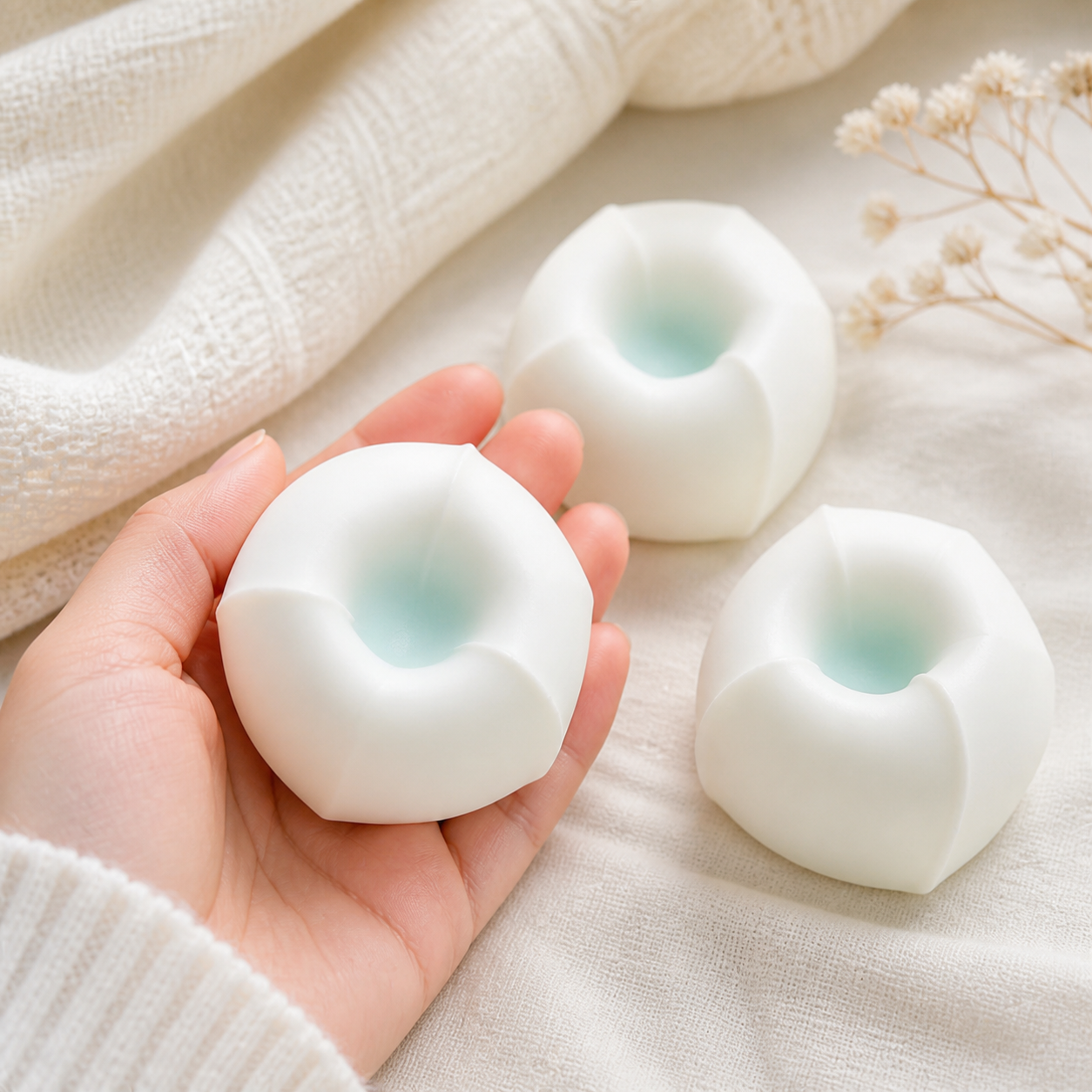 Tofu mochi squishy stress balls in a soft cozy scene