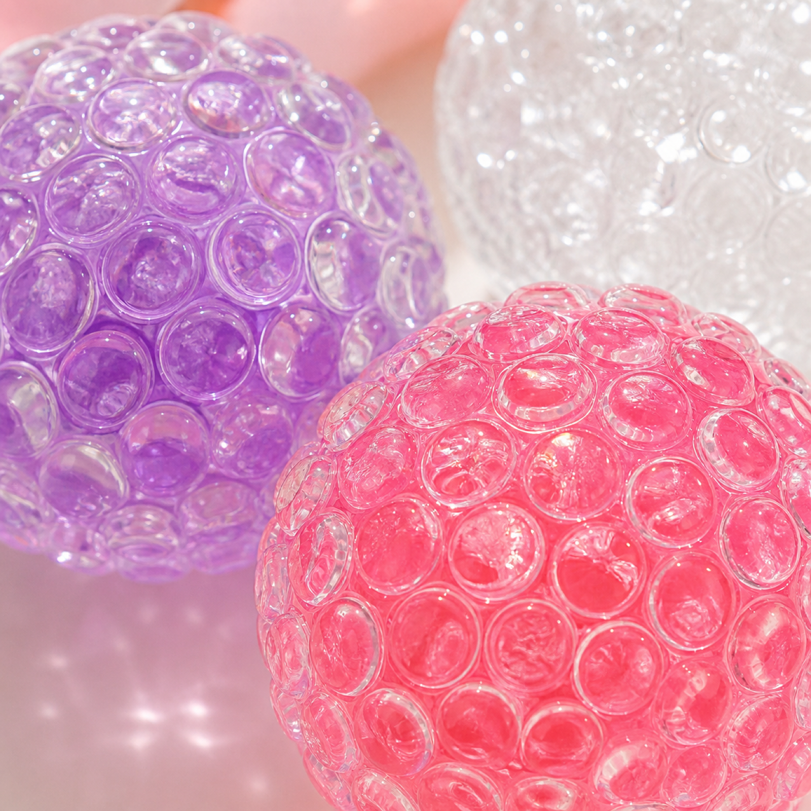Close-up of raised bead texture on translucent chatter ball fidgets