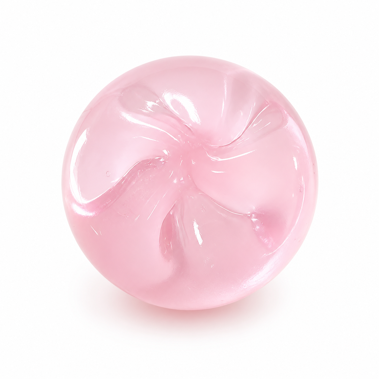 Pink translucent round stress ball on a clean warm white background